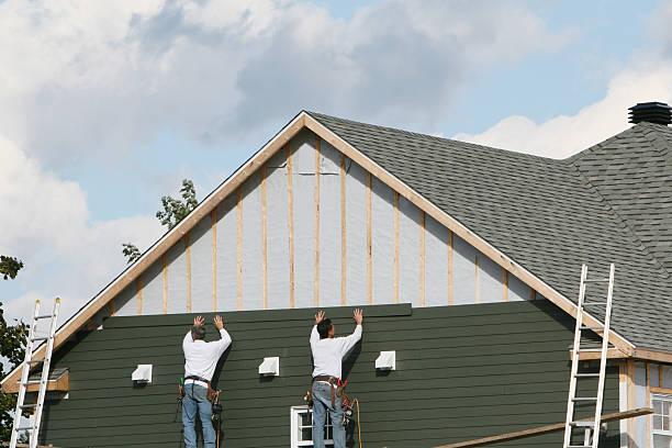 Professional Storm Damage Siding Repair technician working in Windsor Locks, CT